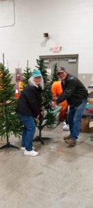 Patriots putting together a few of the donated trees.