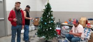 Decorating one of the trees.