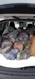 Additional Walmart donations packed in a patriots car.